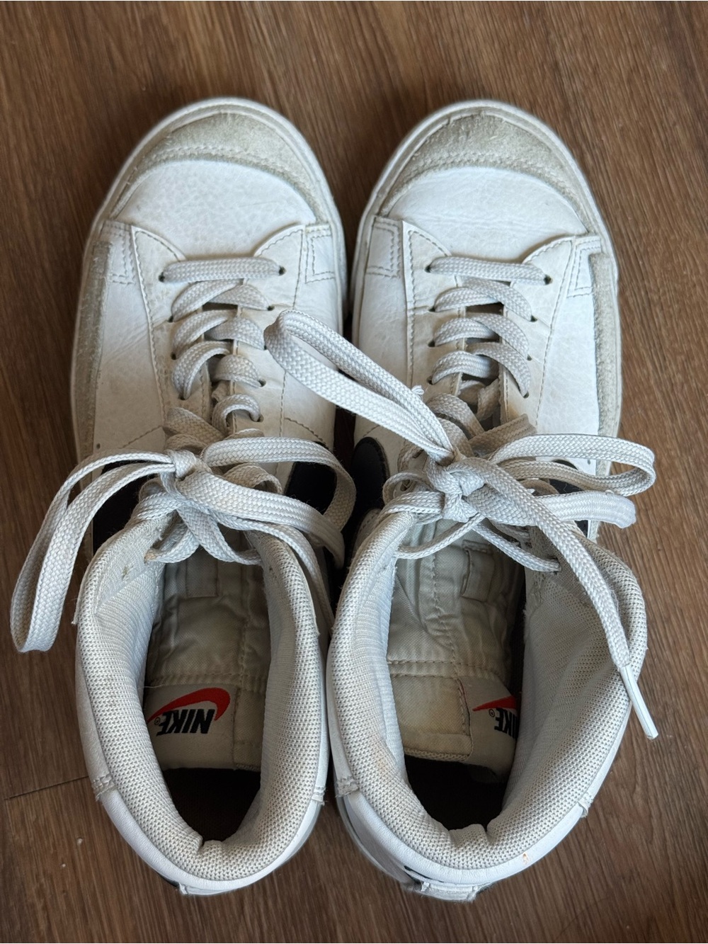 Nike White High-Top Sneakers with Black Swoosh